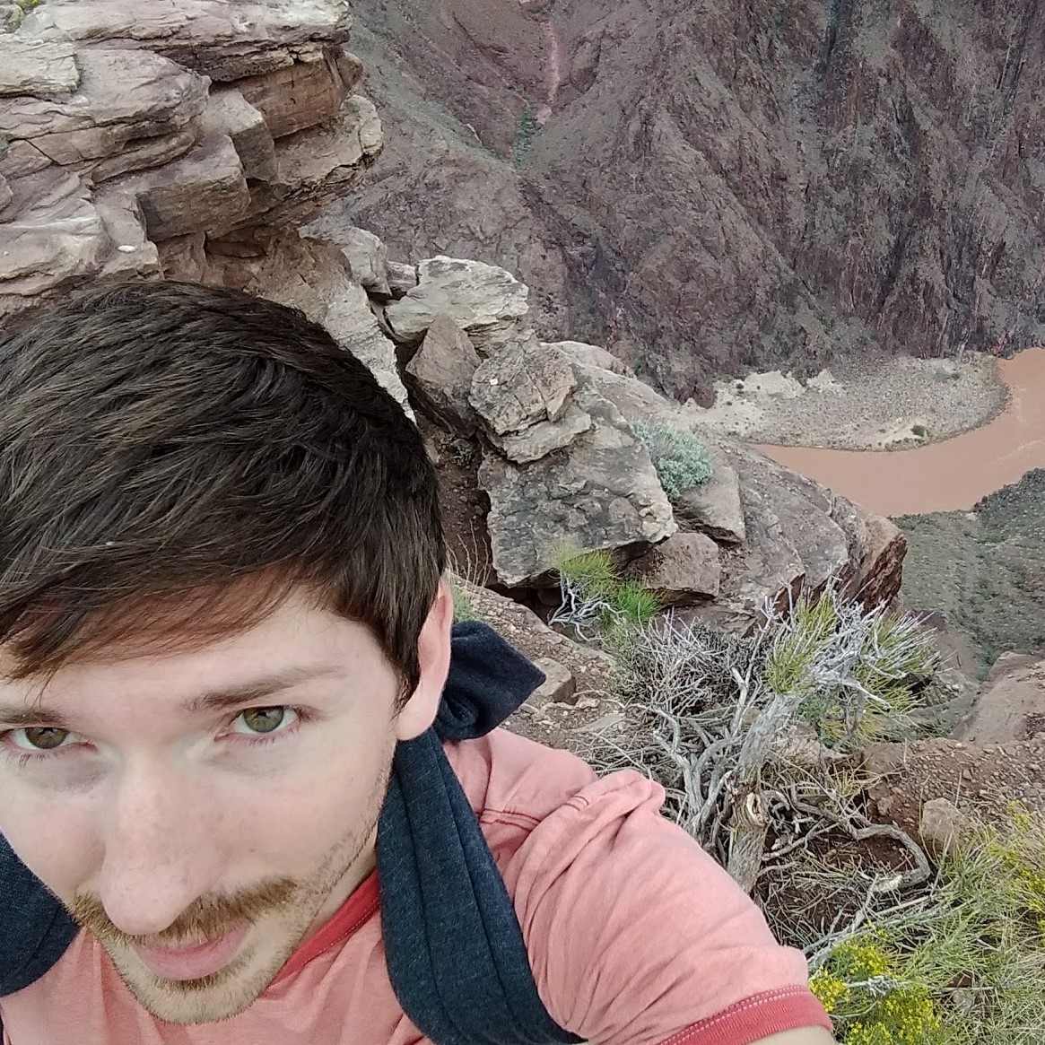 Brys in foreground taking selfie of canyon in background